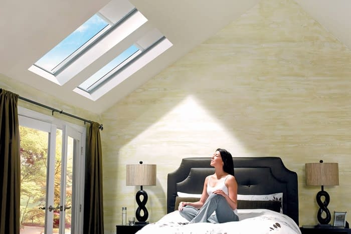 A woman enjoying the benefits of a skylight